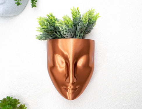 copper wall planter with succulent